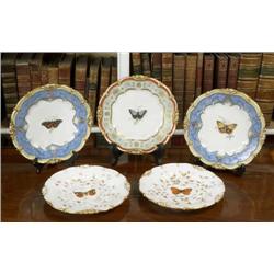 A SET OF THREE FRENCH DESSERT PLATES, circa 1835, by HONORÉ, the centres painted with, butterflies..