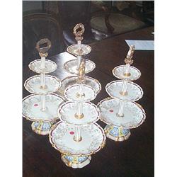 A SET OF FRENCH THREE-TIER GRADUATED FRUIT STANDS, circa 1835, by HONORÉ, with gilded carrying handl