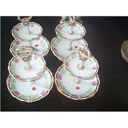 A SET OF FOUR FRENCH TWO-TIER FRUIT STANDS, circa 1835, by HONORÉ, with gilt carrying handles, each.