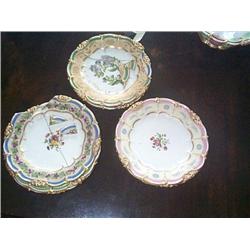 A COLLECTION OF NINE FRENCH DESSERT PLATES, circa 1835, by HONORÉ, decorated with, flowers, each w..