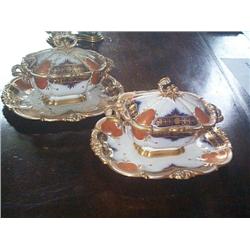 A PAIR OF SMALL FRENCH TUREENS, COVERS AND STANDS, circa 1835, by HONORÉ, decorated in an imari patt