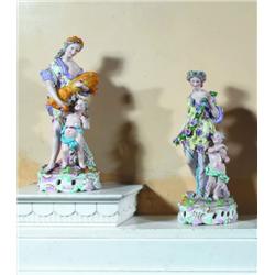 A SET OF FOUR CONTINENTAL PORCELAIN GROUPS, circa 1900, representing the four seasons on circular pi