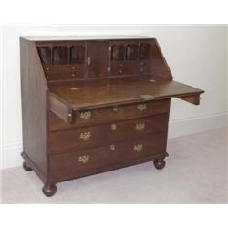 A GEORGE III MAHOGANY BUREAU,, circa 1780, with rectangular hinged slope enclosing a fitted interi..