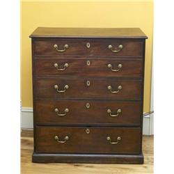 A GEORGE III MAHOGANY SECRETAIRE-CHEST, circa 1780, the moulded rectangular top above two simulated.