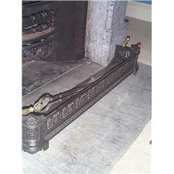 A WILLIAM IV CAST-IRON FENDER, circa 1835, of rounded rectangular form with pierced foliate frieze.<