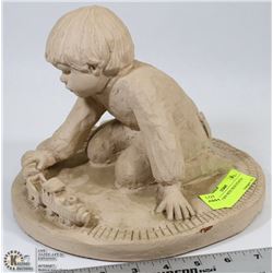 HEAVY BOY WITH TRAIN STATUE