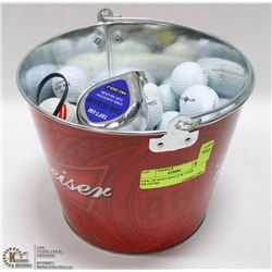 PAIL OF GOLF BALLS W/ TAPE MEASURE