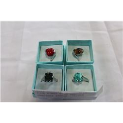 FOUR RINGS WITH VARIOUS PRECIOUS STONES