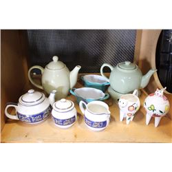 LOT OF TEAPOTS AND CREAM AND SUGARS