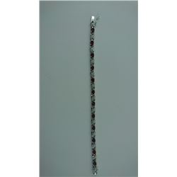 6CT GARNET + DIAMOND TENNIS BRACELET. 12 OVAL GARNETS. CROSSOVER LINKS INCLUDES $550 CERTIFICATE