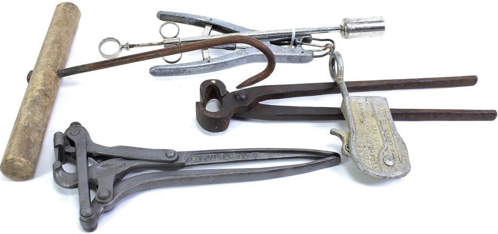 Collection of vintage ranching tools includes nippers, pill pusher ...