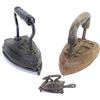 Image 1 : Collection of 3 antique sad irons 2 on trivets includes small childs toy 3" long.