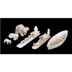 Two Inuit Bone Dog Sleds 6" L. and 5" L., Inuit Walrus Ivory Umiak 7" L. and Three Assorted Figures 