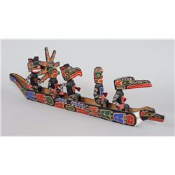 Kwakwaka'wakw Canoe with Five Paddlers Carved by Jimmy Joseph 31" L. 11" H.  Good Condition