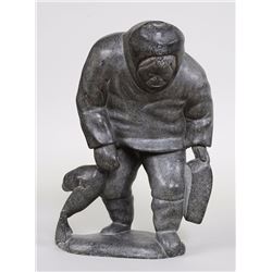 Inuit Soapstone Carving of a Man and Seal Signed Levi Qumaluk 13 3/4" H. 9 1/2" W.  Good Condition