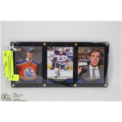 DISPLAY FRAME OF MCDAVID CARDS COMMEMMORATING 1ST