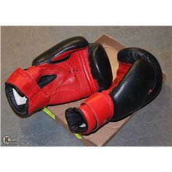 A PAIR OF 14 OZ BOES LEATHER BOXING GLOVES