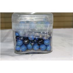 GLASS VASE OF MARBLES