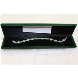 STERLING EMERALD AND RUBY TENNIS BRACELET