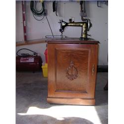 Antique sewing machine w/ full cabinet