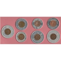 Lot of 8 Aluminum Encased Coins
