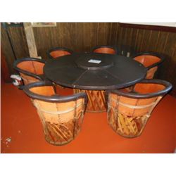 (1) 36"x29" round table with rotating top and (6) woven bottom chairs