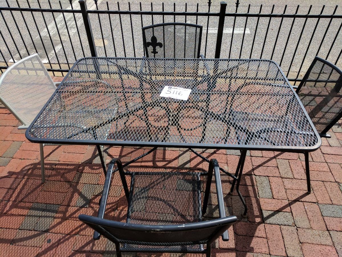 (1) 60"x38"x29" wrought iron and mesh patio table with (4) chairs J.M. Wood Auction Company, Inc.