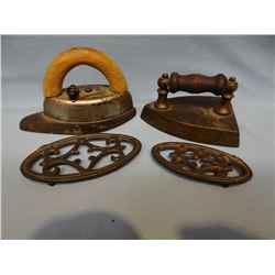 2 small sad irons, wood handles, 2 trivets