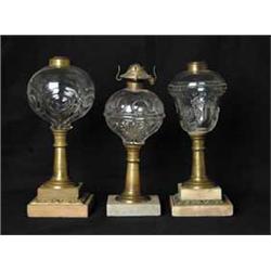 THREE PRESSED GLASS OIL LAMPS