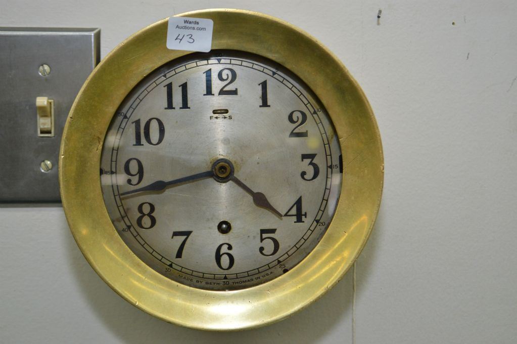 Brass Seth Thomas ship's clock with key, 7 1/4" in diameter, working at