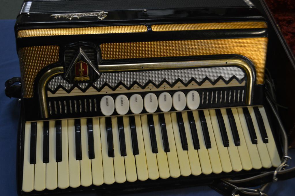 Frontalini bass accordion with leather straps in fitted and lined hard case