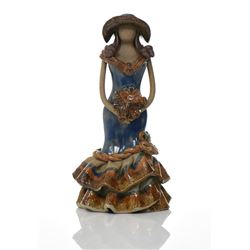 Glazed Ceramic Figure Of A Woman Holding A Bo