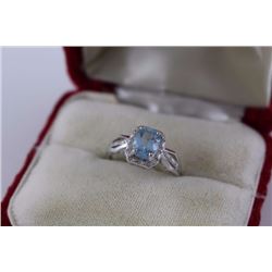 RING - 2CT BLUE AND 2 WHITE TOPAZ IN STERLING SILVER SOLITAIRE DESIGNED SETTING - RETAIL ESTIMATE $3