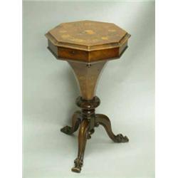 A Victorian walnut and floral marquetry octagonal top work table with fitted interior on cabriole...