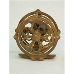 An unusual all brass fly reel, the 2.25in. drum with pierced apertures and turned wood handle on...