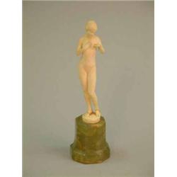 A Preiss style carved ivory figure of a nude maiden on green ivory socle (a.f.) 7ins...