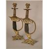 Image 1 : A pair of Victorian brass mounted Prussian sword hilt candlesticks 12in....