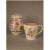 Image 1 : A Poole pottery vase with floral decoration 8.25in., and a jug 5.5in....