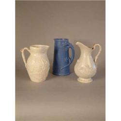 A Sylvac jug with dragon handle 8.5in., a Victorian press moulded jug and another jug...