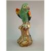 Image 1 : A Meissen figure of a parrot, perched upon a tree stump, 16ins (restored)...