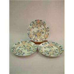 A set of 3 Delft polychrome plates, with floral decoration, 9ins...