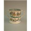 Image 1 : A Victorian pottery loving cup, printed with comical figures, 8ins...