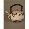 Image 1 : A porcelain teapot of rustic design, with blossom decoration (Possibly Minton)...