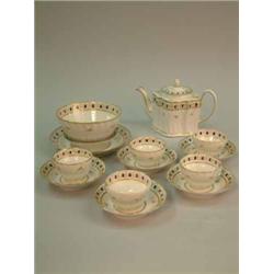 A Newhall 14-piece part tea set, with gilt floral banding and spiral fluted moulding....