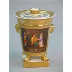 A 19th century German porcelain pot pourri vase and cover, decorated with a panel of dancing figu...