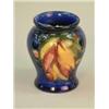 Image 1 : A Moorcroft leaf and berry pattern blue ground vase 3.25 ins....
