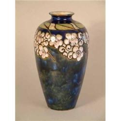 A Royal Doulton stoneware baluster vase, decorated with blossom on a blue ground 8.5in....