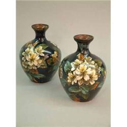 A pair of Doulton Lambeth faience vases, decorated with apple blossom on a blue ground by Mary Ai...