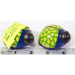 A PAIR OF VINTAGE LEHMANN LILI TIN LADYBUGS