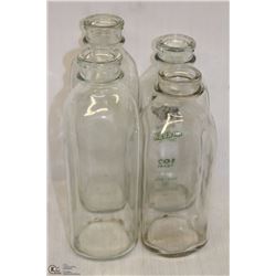 A BOX W/ 4 ANTIQUE MILK BOTTLES